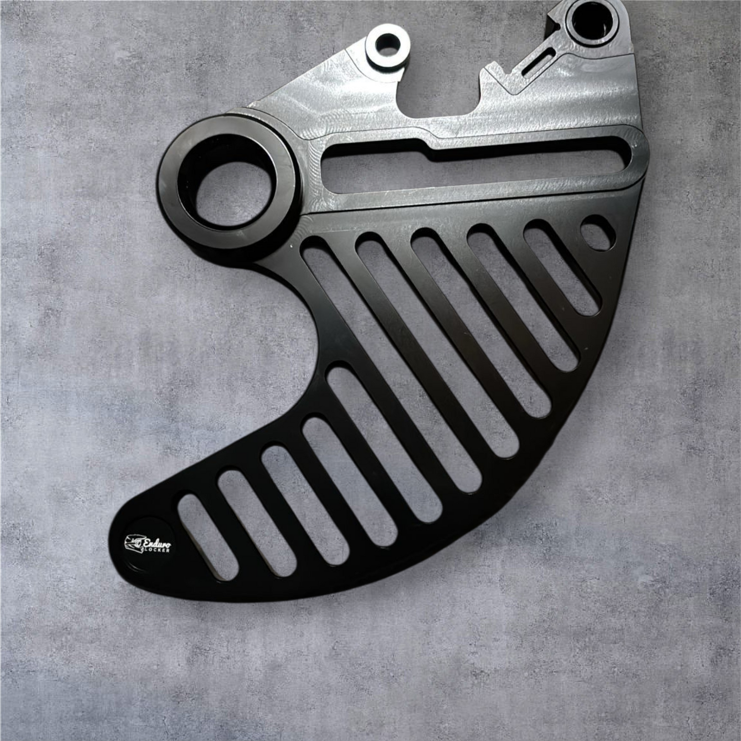 Hard enduro rear brake disk guard.