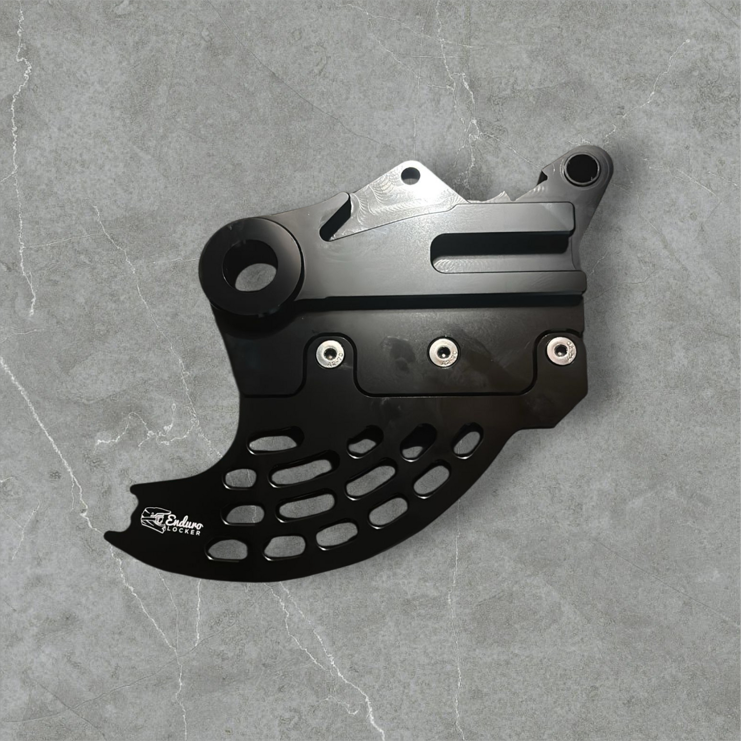Hard enduro rear brake disk guard.