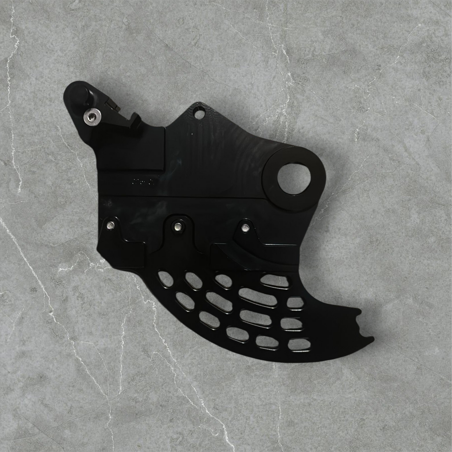 Hard enduro rear brake disk guard.