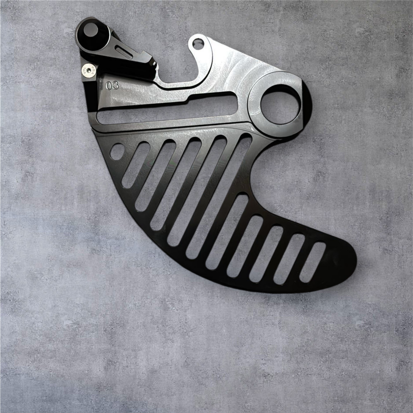 Hard enduro rear brake disk guard.